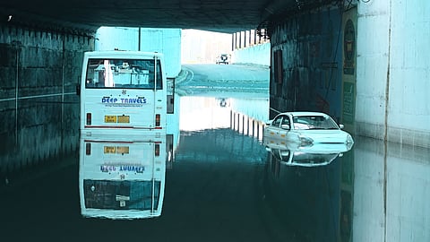 A bus and a car are submerged in water in the Delhi Cantt area after heavy rains caused severe waterlogging in several parts of the National Capital in New Delhi on Sunday.