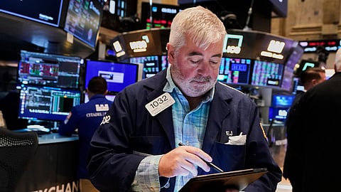 A trader works on the floor of the New York Stock Exchange, Tuesday, May 20, 2025.