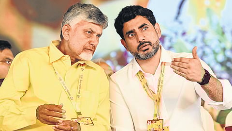 HRD Minister Nara Lokesh discusses a point with Chief Minister N Chandrababu Naidu during the TDP Mahanadu in Kadapa on Tuesday