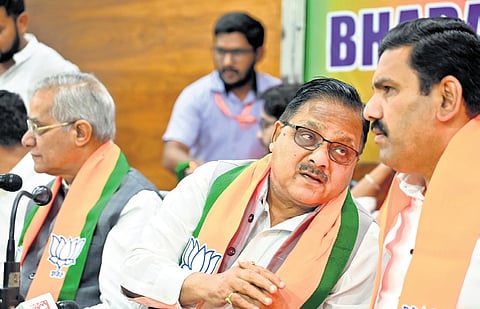 BJP General Secretary Radha Mohan Das Agrawal and state party chief BY Vijayendra in a discussion at BJP office in Bengaluru on Wednesday.