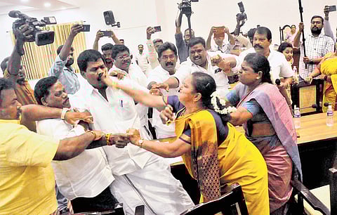 Councillor S Sugashini slaps opposition leader M Yadavamoorthi during the council meeting of the Salem City Municipal Corporation on Thursday
