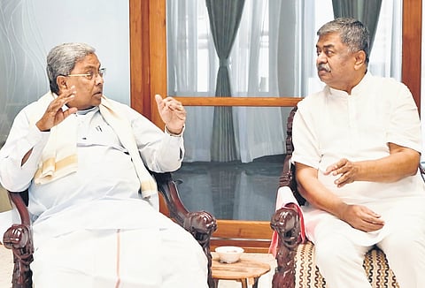 Chief Minister Siddaramaiah in conversation with Legislative Council member
BK Hariprasad in Bengaluru on Thursday.