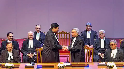 Chief Justice of India (CJI) B R Gavai after administering the oath of office to Justice N V Anjaria during his swearing-in ceremony as Supreme Court judge, in New Delhi.