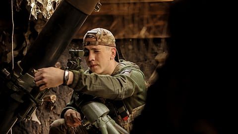 In this photo taken on May 27, 2025 and provided by Ukraine's 24th Mechanized Brigade press service, a soldier prepares a 120mm mortar to fire towards Russian army positions near Chasiv Yar, Donetsk region, Ukraine, Tuesday, May 27, 2025