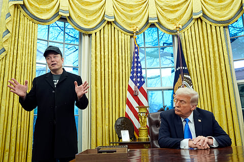 President Donald Trump listens as Elon Musk speaks in the Oval Office at the White House, Feb. 11, 2025, in Washington.