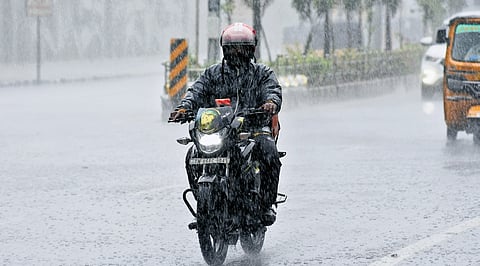 Motorists braving the rain at Walaja Salai in Chepauk, Chennai, on Friday. But Saturday saw clear skies over the city