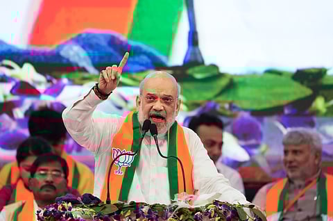 Union Home Minister and senior BJP leader Amit Shah addresses an organisational meeting of the party at Netaji Indoor Stadium in Kolkata, Sunday, June 1, 2025.