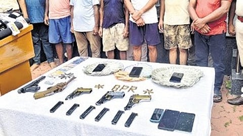 The accused with the seized goods.