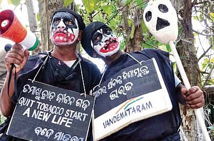Members of a social organisation stage a street play on the occasion of World No Tobacco Day in Bhubaneswar on Saturday.