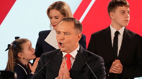 Presidential candidate Karol Nawrocki, a conservative historian backed by the right-wing Law and Justice party addresses supporters at his headquarters after the presidential election runoff in Warsaw, Poland, Sunday, June 1, 2025.