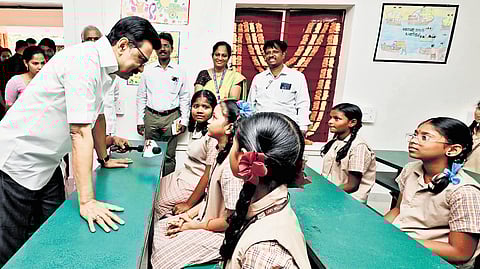 Chief Minister MK Stalin interacting with students of Lady Willingdon Government Model School in Chennai on Monday.