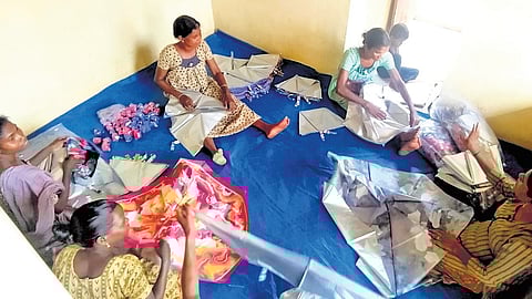 Aralam farm residents manufacturing the umbrellas.