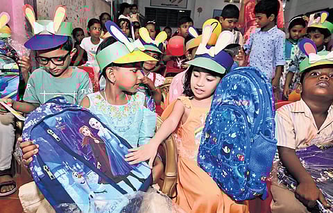 Behsa Karimi interacts with her classmates after being enrolled as a Class 1 student at Government LP School, Mudiyoorkara, on Monday
