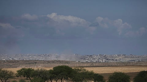 Smoke from Israeli bombardment rises over buildings in the northern Gaza Strip, seen from southern Israel, Monday, June 2, 2025. (AP Photo/Maya Alleruzzo)