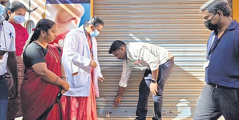 Health officials sealing the dental clinic in Vaniyambadi on Tuesday