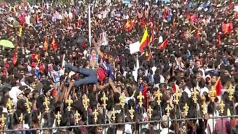 RCB fans at the stadium, celebrating, the team's first win in 18 years, before the tragic stampede occurred.