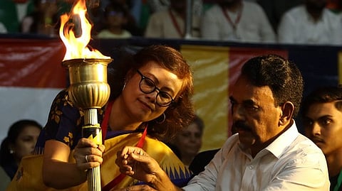 Tourism Minister Jupally Krishna Rao carries the torch during the Miss World Sports Finale at the G. M. C. Balayogi Indoor Stadium.