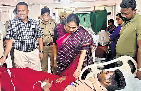 Union minister Shobha Karandlaje inquires about the wellbeing of an injured stampede victim at a hospital in Bengaluru on Thursday