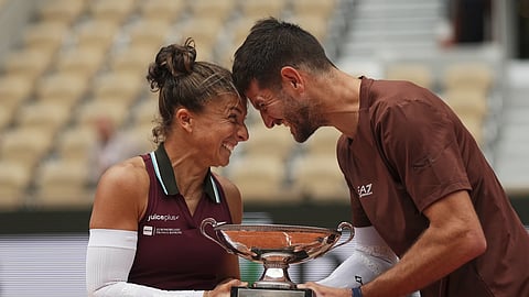 Winner's Italy's Sara Errani and Andrea Vavassori celebrate with the trophy after the mixed doubles final match of the French Tennis Open at the Roland-Garros stadium in Paris, Thursday, June 5, 2025.
