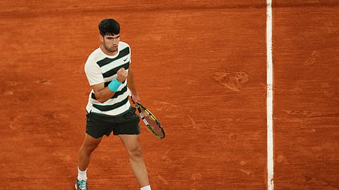 Spain's Carlos Alcaraz reacts as he plays against Italy's Lorenzo Musetti during their semifinal match of the French Tennis Open at the Roland-Garros stadium in Paris, Friday, June 6, 2025.