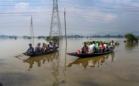 Villagers being shifted to a safer place from a flood-affected area at Bura Mayang in Morigaon district, Assam, Friday, June 6, 2025.