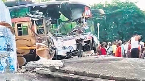 Mangled bus after hitting the rest shed.
