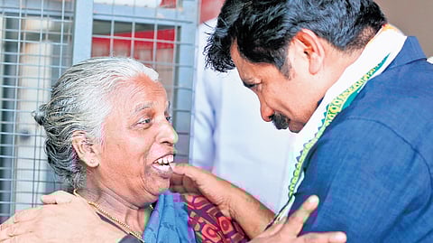 UDF candidate Aryadan Shoukath interacts with an elderly woman while campaigning at Edakkara panchayat in Nilambur on Friday
