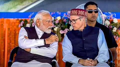 Prime Minister Narendra Modi with Jammu and Kashmir Chief Minister Omar Abdullah during the foundation stone laying and inauguration of various development projects at Katra, in Reasi district.