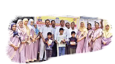 Officials and teachers with students who have rejoined school as part of the ‘Come, Come to School, for a Bright Future’ campaign in Gadag