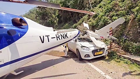 A private helicopter en route to Kedarnath Dham makes an emergency landing in Guptkashi due to a technical fault, in Rudraprayag on Saturday. All the people on board the helicopter are safe.
