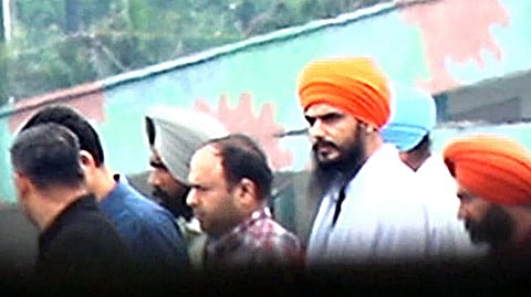 In this April 23, 2023, photo, 'Waris Punjab De' chief Amritpal Singh, who was arrested by the Punjab Police, was brought to Dibrugarh Jail in Assam.