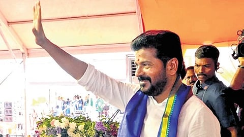 CM A Revanth Reddy waves to the crowd at a public meeting at Thirumalapur village in Yadadri-Bhuvanagiri on Friday.