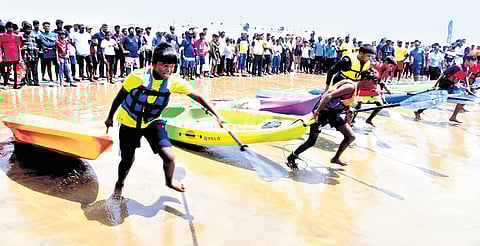 Athletes take part in the sea kayaking competition at Manginapudi Beach