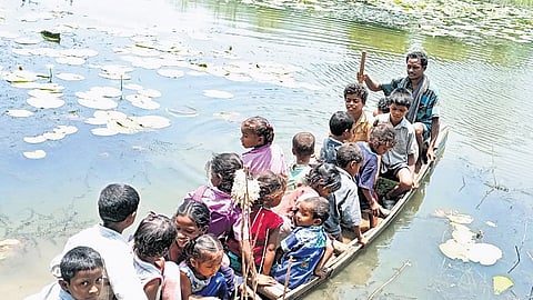 Tribal students of Solubongu hamlet in ASR district take a boat ride to reach school