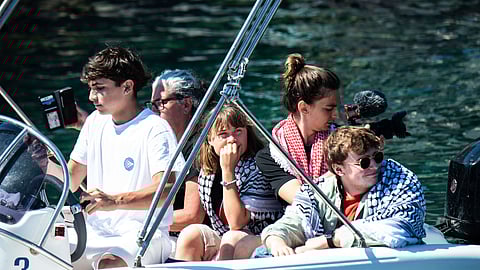 Climate activist Greta Thunberg, center, waits to board the Madleen boat, before setting sail for Gaza along with activists of the Freedom Flotilla Coalition, departing from the Sicilian port of Catania, Italy, Sunday, June 1, 2025.