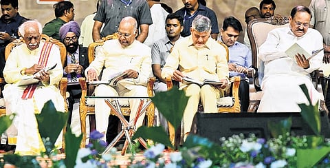 Former President Ram Nath Kovind, former V-P M Venkaiah Naidu and AP CM N Chandrababu Naidu take a look at the autobiography on Sunday
