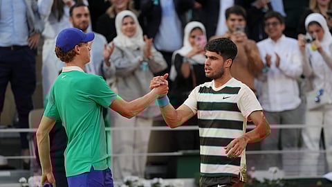 Winner Spain's Carlos Alcaraz, right, and Italy's Jannik Sinner shake hands after the final match of the French Tennis Open at the Roland-Garros stadium in Paris, Sunday, June 8, 2025.