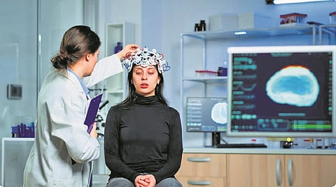 Representative picture of a woman getting a brain scan