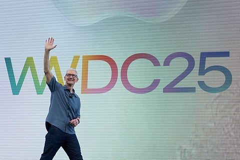 Apple CEO Tim Cook waves to attendees during an event on the Apple campus in Cupertino, Calif., Monday, June 9, 2025.