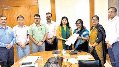 Mohanty submitting the draft to H&UD secretary Usha Padhee.