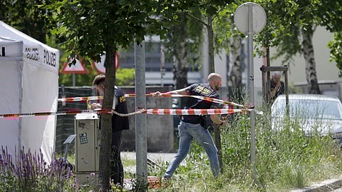 Police work near a school where several people died in a shooting, on June 10, 2025 in Graz, southeastern Austria