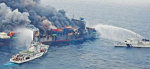 Coast Guard ships attempt to douse the fire that broke out on container ship Wan Hai 503