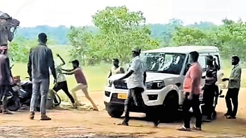 Video grab of miscreants assaulting the junior mining officer on Tuesday.