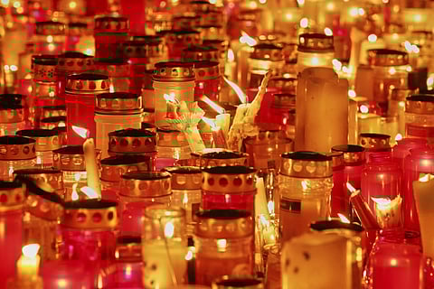 Candles lit on the main square in the city center after a deadly shooting at a school in Graz, Austria, Tuesday, June 10, 2025.