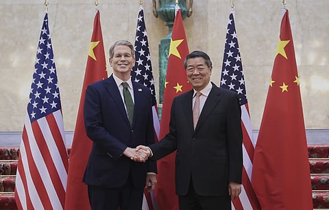 In this photo released by Xinhua News Agency, Chinese Vice Premier He Lifeng, right, shakes hands with US Treasury Secretary Scott Bessent before their meeting to discuss China-US trade, in London, Monday, June 9, 2025.