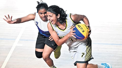 Players in action during state U-23 3/3 basketball championship held in Kochi.