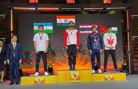 Deepak Poonia (C) on top of the podium during the Thailand Open International Boxing Tournament, an event that was held from May 22 to June 2