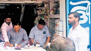 Drug control officials raiding a medicine store in Ranihat area on Tuesday.