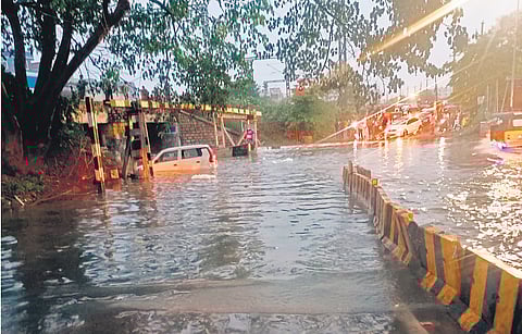 Rains inundate a road leading to Lingampally RuB on Thursday