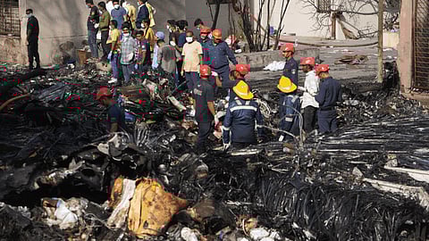 Heavy black smoke was seen rising from the crash site near Forensic Cross Road. Visuals from local crews show extensive wreckage and fire. Firefighters and rescue personnel are on site conducting evacuation and containment